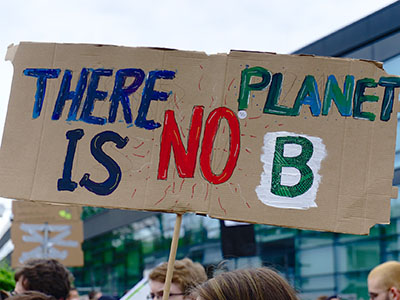 Sign at a climate march that reads "There Is No Planet B"
